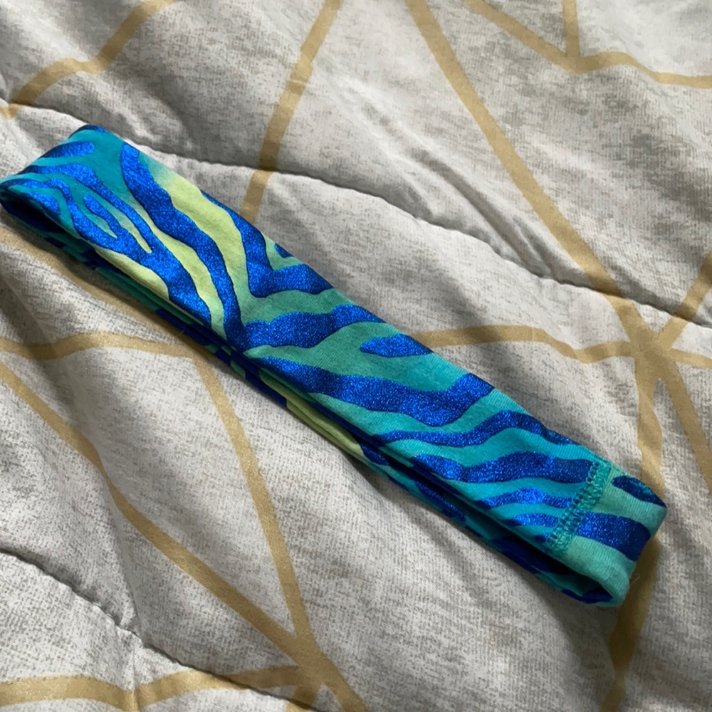 Zebra print headband with some glitter stripes.